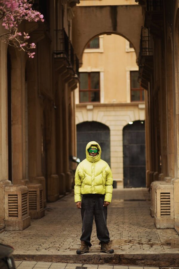 Young Man Wearing a Large Puffer Jacket and Wide Leg Pants